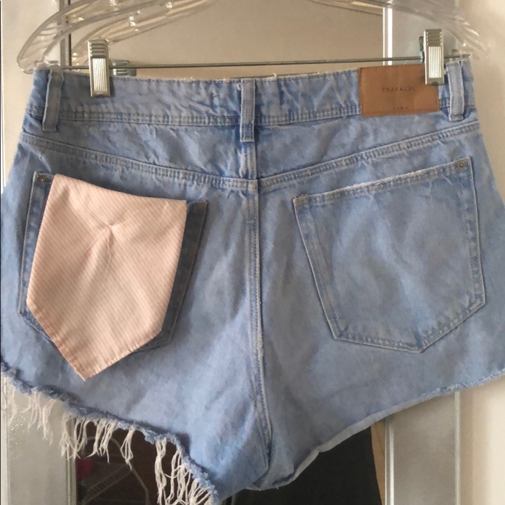 Shorts with peekaboo pockets